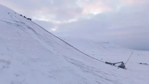 Drone Push Forward With Left Pan Over Coal Mining Cableway in Svalbard Stock Footage 342834723