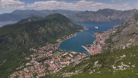 Drone Push over Bay of Kotor with Foreground Mountain Cliff Framing, 4K Stock Footage 337179881