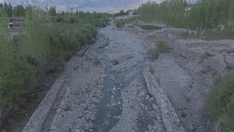Drone Push In Over Ladakh Dry River Stream Revealing Mountain Valley Beyond Stock-Footage 335760328