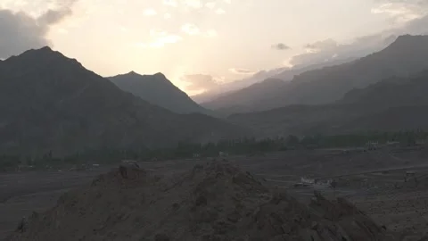 Drone Push In Over Ladakh Mountain Village at Golden Sunset with Traffic Over Vídeos de archivo 335745547