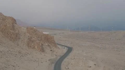 Drone Push In Over Ladakh Road with Utility Poles and Majestic Mountains Over Vídeos de archivo 335745296