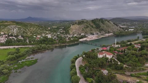 Drone Push Over River to Distant Rozafa Castle with Lightning Strikes, 4K Stock Footage 337178465