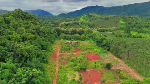 Drone Push Over Rural Home and Fields Near Sangkhlaburi Thailand Stock-Footage 318505467
