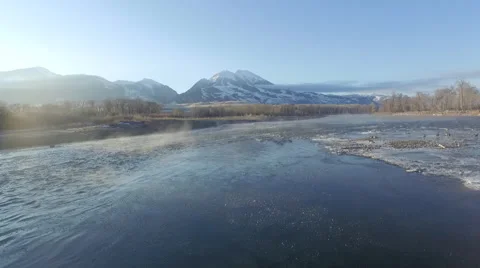 Drone push-in over a steaming river at dawn. Stock Footage 50971266