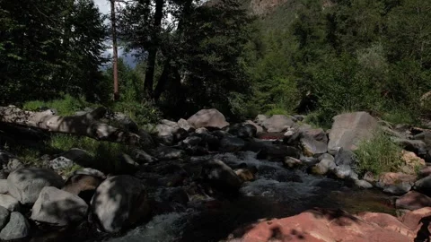 Drone Push-In Over Stream in Oak Creek with Red Rocks Stock Footage 316173500