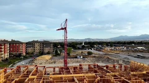 Drone push in over wood-frame apartment construction in Taylorsville, Utah Stock Footage 342167118