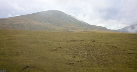 Drone Push In Reveal Mountains Fields CLouds Stock Footage 161546330