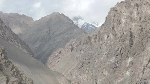 Drone Push In Through Dramatic Ladakh Mountain Valley with Snow Peaks Over the Stock Footage 335743544