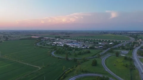 Drone push-in toward A1 Autostrada del Sole and A21 interchange at Fiorenzuola Video stock 340604287