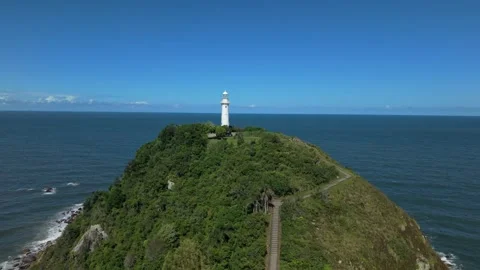 Drone push in toward Farol das Conchas lighthouse on Ilha do Mel, Paraná Vídeo Stock 330837443