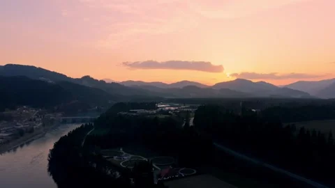 Drone push in toward hydroelectric dam at sunset Stock Footage 330545547