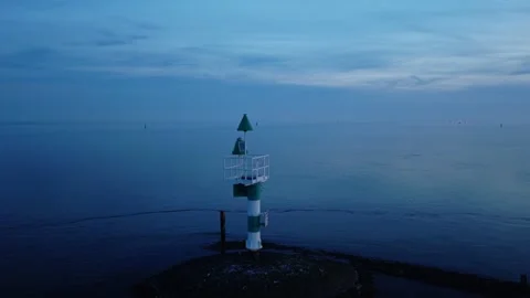 Drone push-in toward navigation beacon in the Wadden Sea near Terschelling Stock Footage 342180394