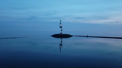 Drone push-in toward navigation beacon in the Wadden Sea near Terschelling Stock Footage 342180453