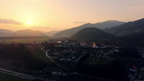 Drone push in toward river town at sunset Stock Footage 330545095