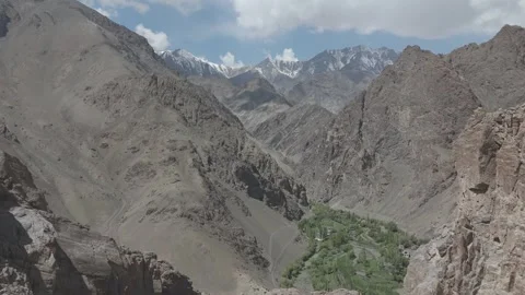 Drone Push In Towards Dramatic Ladakh Mountain Valley Through Rugged Terrain Stock-Footage 335763097