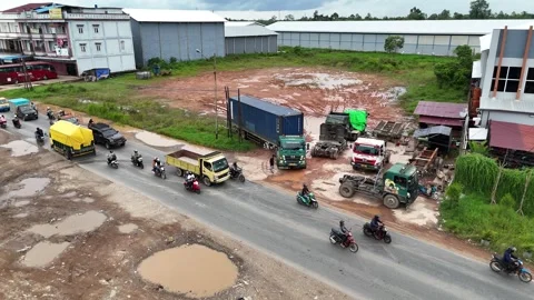 Drone Push-In Traffic Jam with Motorbikes and Container Truck Stock Footage 333400036