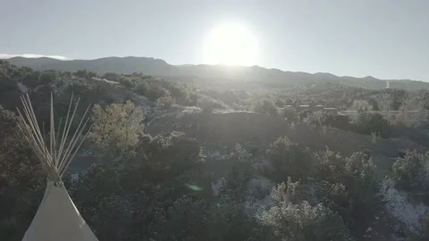 Drone pushes past Native American tent to show snowy landscape in desert Stock-Footage 167670699