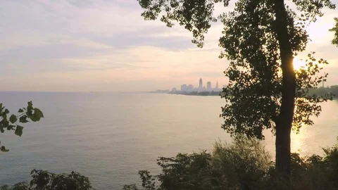 Drone Pushing through trees to Cleveland Skyline - Color Corrected Stock Footage 90141488