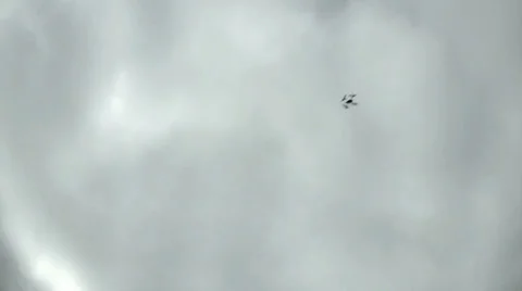 Drone Quad-Copter Circles at High Altitude Overhead Against Cloudy Sky 5 Video stock 33862747