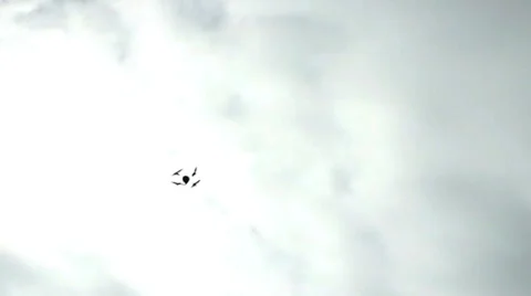 Drone Quad-Copter Flies Overhead Against Cloudy Sky 1 Video stock 33800840