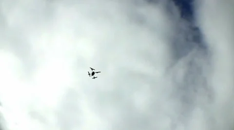 Drone Quad-Copter Flies Overhead Against Cloudy Sky 2 Video stock 33843945