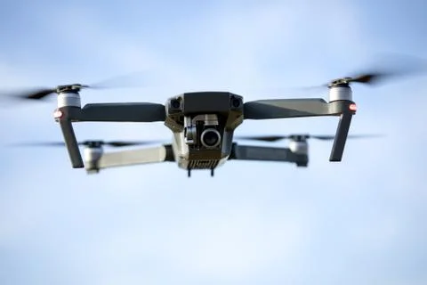 Drone quad copter with high resolution digital camera on the sky Stock Photos