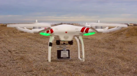 DRONE QUAD-COPTER HOVERING REMOTE RADIO CONTROLLED FLYING MACHINE Stock Footage 38053760