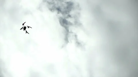 Drone Quad-Copter Strafes Past Camera Overhead Against Cloudy Sky 3 Video stock 33862664