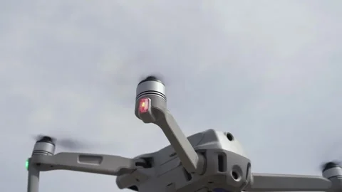 Drone quadcopter with digital camera and fast rotating propellers flying taki Video stock 333722047