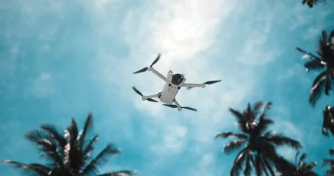 Drone quadcopter flying in slow motion. Drone copter flying in air on blue sky Video stock 256915769