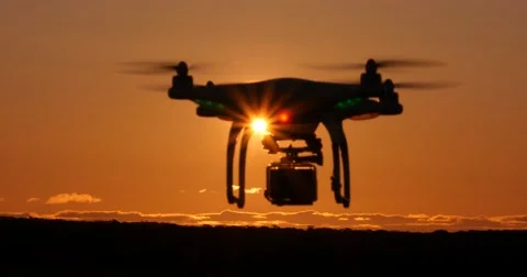 Drone quadcopter multirotor flying with camera during sunset Stock Footage 67219836