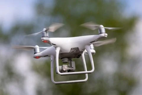 Drone quadrocopter with high resolution digital camera on the sky background. Stock Photos