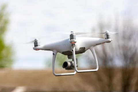 Drone quadrocopter with high resolution digital camera on the sky background. Stock Photos