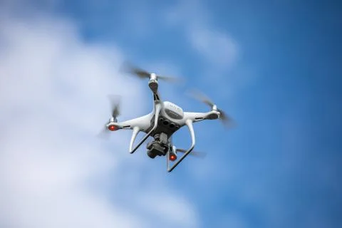 Drone quadrocopter with high resolution digital camera on the sky background. Stock Photos