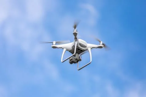 Drone quadrocopter with high resolution digital camera on the sky background. Stock Photos