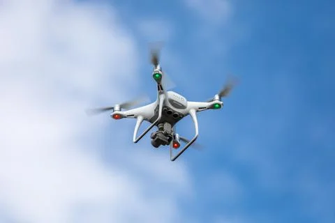 Drone quadrocopter with high resolution digital camera on the sky background. 写真素材