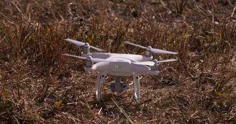 Drone Quadrocopter Takes OFF from ground Slow Motion Close-up shot Stock Footage 93794471