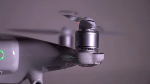 Drone quadrocopter working propeller and motor. Close up. Slider shot. 4K Stock Footage 128100223