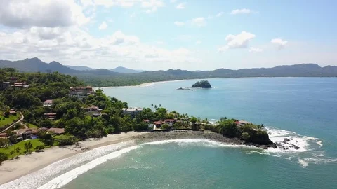 Drone quick panning video of Playa Flamingo shoreline Stock Footage 90970728