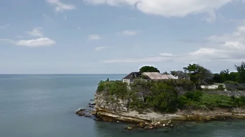Drone quickly flies around the island with Fort James ruins, A liner is visible Video stock 135568352