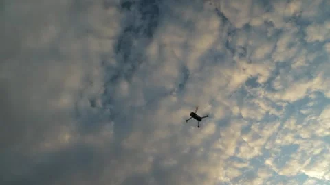 Drone quickly flies from top left to bottom right across sky Stock Footage 323140290