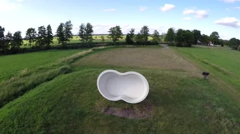 Drone race course flying over white bench on a small hill 4k Stock Footage 52120603