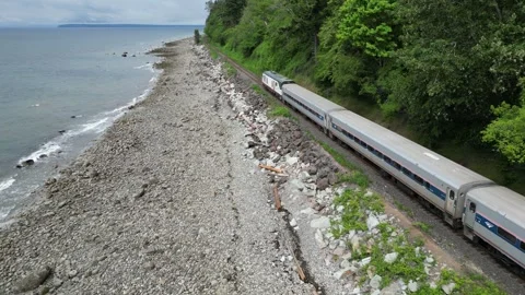 Drone races train along beach Stock Footage 345362869