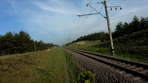 Drone racing view. Fly over railways in forest at sunrise. 库存影片 112431524
