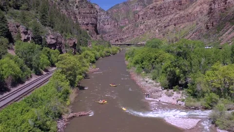 Drone:  Rafts Float on Colorado River in Glenwood Canyon Stock Footage 195823527