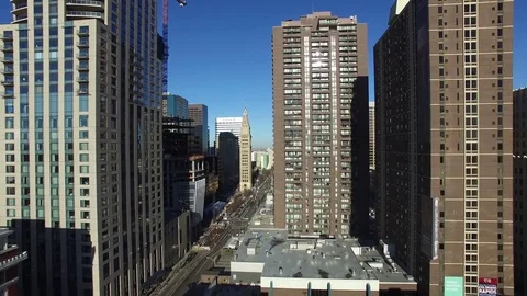 Drone raising above downtown denver streets Stock Footage