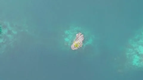 Drone, Raja Ampat small islands and reef in blue water Stock Footage 130315293