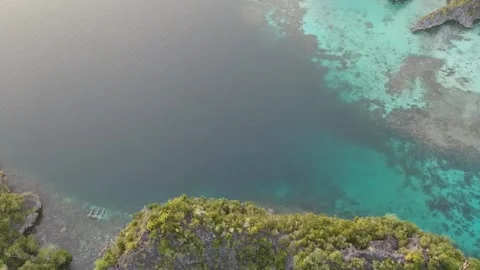 Drone, Raja Ampat sunset over jungle islands and blue water Stock Footage 130315364
