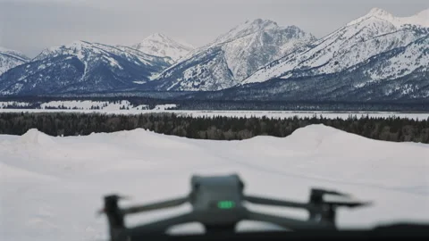 Drone ready to fly against mountains Stock Footage 313453259