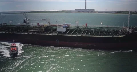 Drone Recording of a Cargo ship &amp; a Pilot Boat, 4K Stock Footage 182892615